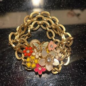 JUICY COUTURE: Gold plated bracelet with flowers